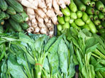 Assortment Of Green Vegetables On A Market Stall